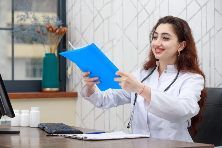 Portrait of young smiling health care worker holding analysis. High quality photo